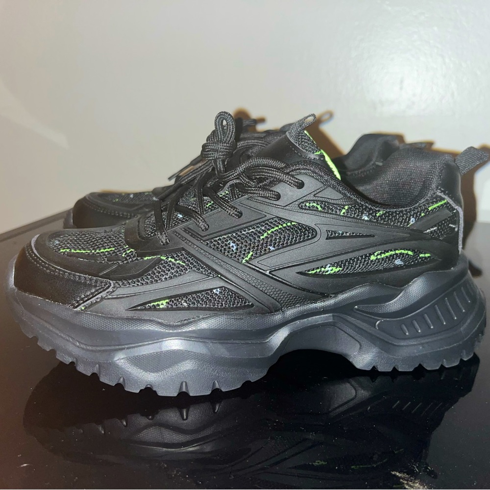 These Shoes are from CUCCOO with black & green stripes on the front & inside.